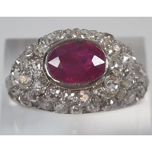 365 - Platinum, ruby and diamond bombe ring.  6.5g approx.  Size O 1/2.  (B.P. 21% + VAT)