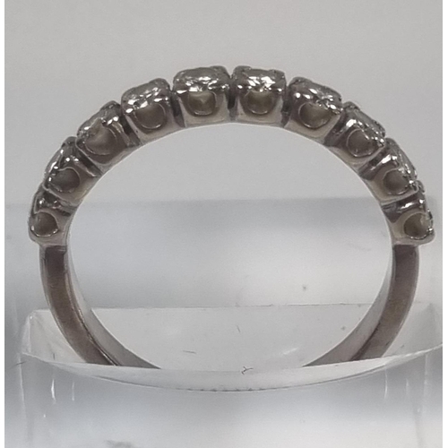 371A - White metal half hoop ten stone diamond eternity ring.  3.3g approx. Size M.  (B.P. 21% + VAT)