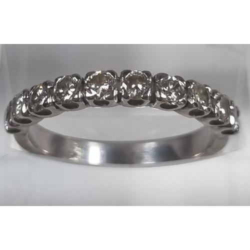 371A - White metal half hoop ten stone diamond eternity ring.  3.3g approx. Size M.  (B.P. 21% + VAT)