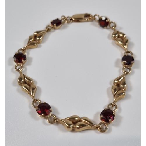 378 - 9ct gold six stone garnet bracelet.  10.6g approx.  19cm long approx.  (B.P. 21% + VAT)