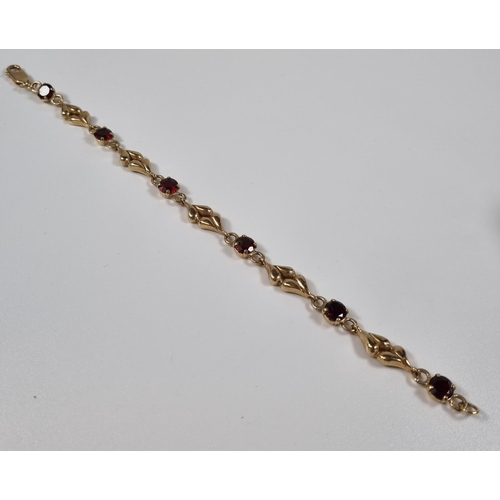 378 - 9ct gold six stone garnet bracelet.  10.6g approx.  19cm long approx.  (B.P. 21% + VAT)