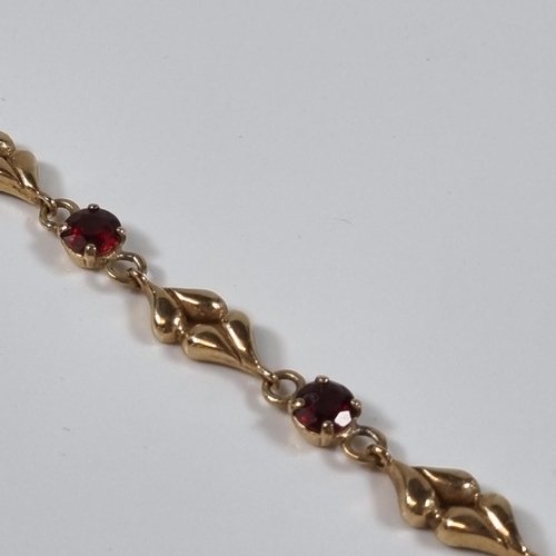 378 - 9ct gold six stone garnet bracelet.  10.6g approx.  19cm long approx.  (B.P. 21% + VAT)