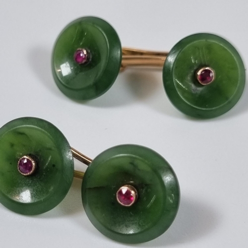 386 - Pair of French ruby and jade cufflinks of circular moulded form inset with rubies.  (B.P. 21% + VAT)