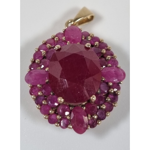 387 - 9ct gold and ruby pendant.  5g approx.  Length 2cm approx.  (B.P. 21% + VAT)