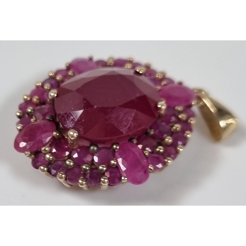 387 - 9ct gold and ruby pendant.  5g approx.  Length 2cm approx.  (B.P. 21% + VAT)