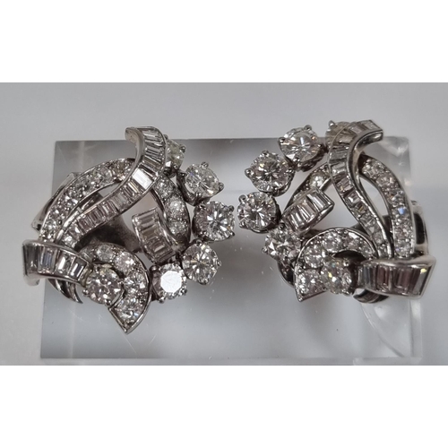 389 - Pair of diamond and platinum clip on earrings, of brilliant cut and baguette form.  12g approx.  (B.... 