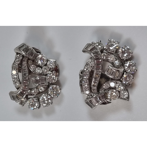 389 - Pair of diamond and platinum clip on earrings, of brilliant cut and baguette form.  12g approx.  (B.... 