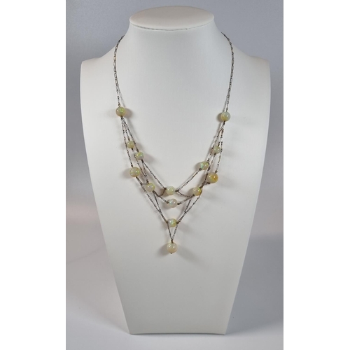 396 - 19th century French gold and platinum fourteen stone opal necklace in retailer's box marked 'Arnos P... 