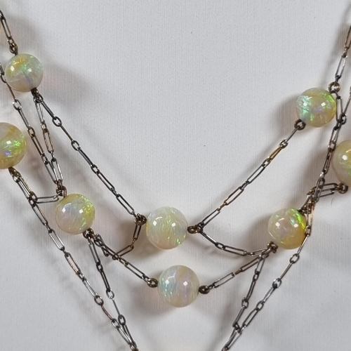 396 - 19th century French gold and platinum fourteen stone opal necklace in retailer's box marked 'Arnos P... 