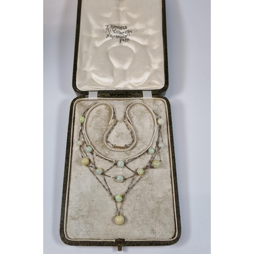 396 - 19th century French gold and platinum fourteen stone opal necklace in retailer's box marked 'Arnos P... 