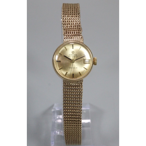 409 - Ladies Omega 9ct gold automatic bracelet wristwatch, having gold coloured satin face with date apert... 