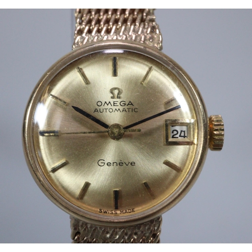 409 - Ladies Omega 9ct gold automatic bracelet wristwatch, having gold coloured satin face with date apert... 