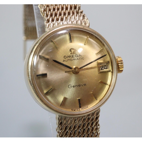 409 - Ladies Omega 9ct gold automatic bracelet wristwatch, having gold coloured satin face with date apert... 