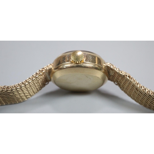 409 - Ladies Omega 9ct gold automatic bracelet wristwatch, having gold coloured satin face with date apert... 