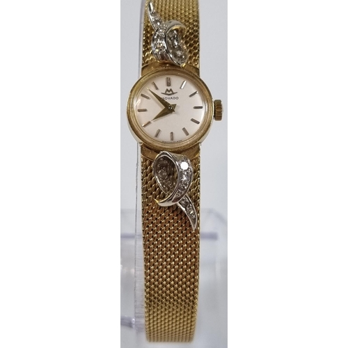 415 - Movado 18ct gold ladies diamond set bracelet wristwatch, having satin face with baton numerals, deco... 