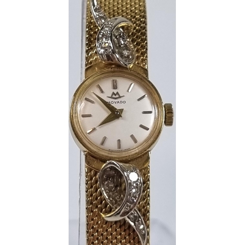 415 - Movado 18ct gold ladies diamond set bracelet wristwatch, having satin face with baton numerals, deco... 