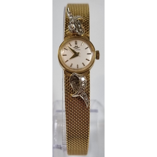 415 - Movado 18ct gold ladies diamond set bracelet wristwatch, having satin face with baton numerals, deco... 