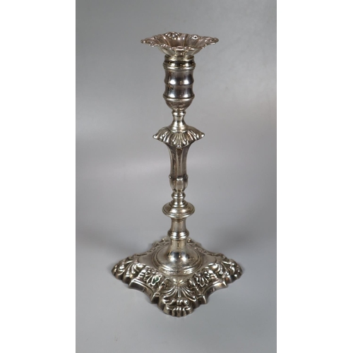 435 - Two similar pairs of18th century Irish silver candlesticks with removeable repoussé sconces above ba... 