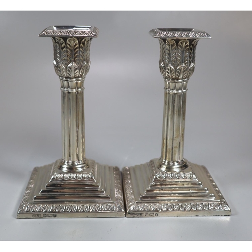 437 - Pair of late 19th century silver candlesticks having relief acanthus leaf decoration, Corinthian col... 