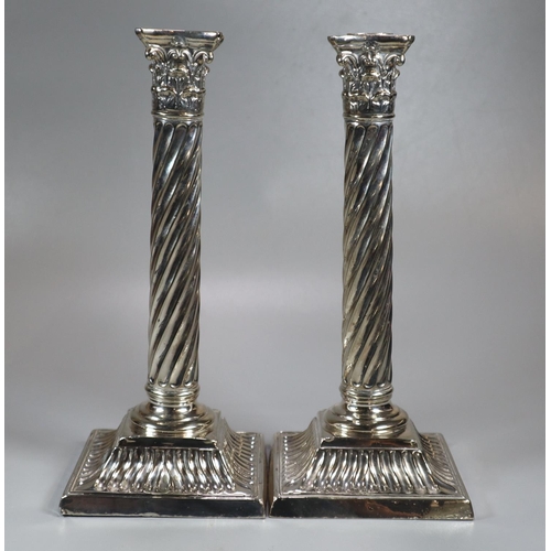 437 - Pair of late 19th century silver candlesticks having relief acanthus leaf decoration, Corinthian col... 