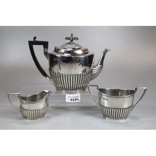 443 - Edward VII silver fluted three piece service, the teapot with geometric ebonised handle, to include:... 