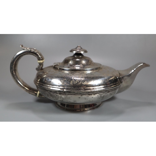 446 - 19th century silver bullet shaped teapot with acanthus leaf moulded decoration to the handle, armori... 