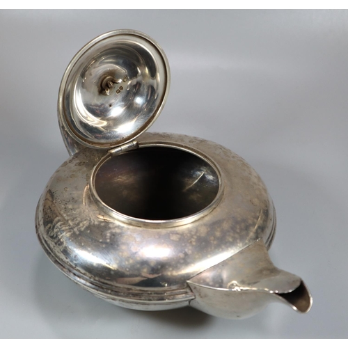 446 - 19th century silver bullet shaped teapot with acanthus leaf moulded decoration to the handle, armori... 