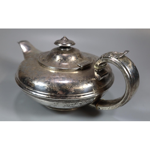 446 - 19th century silver bullet shaped teapot with acanthus leaf moulded decoration to the handle, armori... 