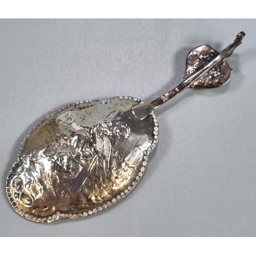 452 - Three Dutch silver spoons with repoussé decoration of a fisherman with his catch and heart shaped te... 