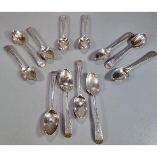 461 - Set of twelve Georgian bright cut silver dessert spoons.  London hallmarks, George IV 1821.  Probabl... 