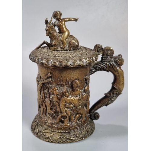 466 - 19th century French bronze lidded tankard with pictorial scene of relief moulded cherubs, goat and c... 