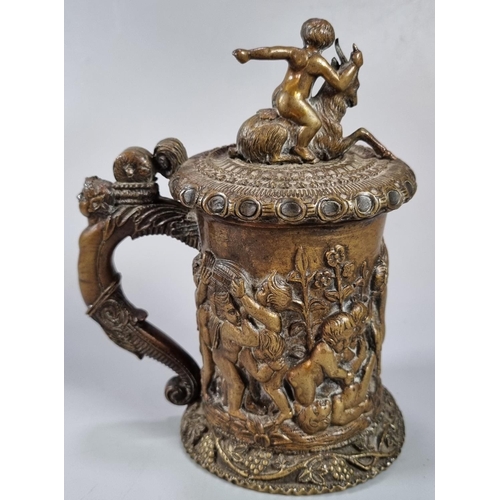 466 - 19th century French bronze lidded tankard with pictorial scene of relief moulded cherubs, goat and c... 