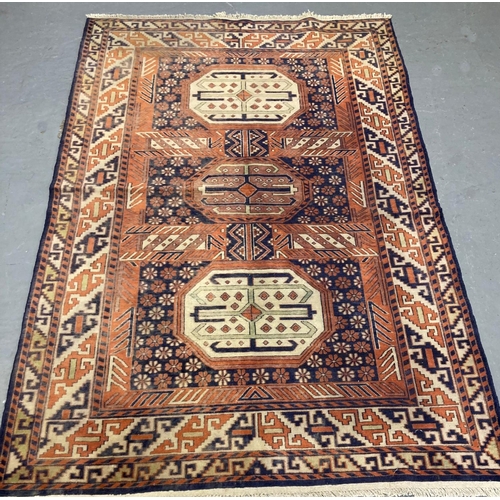 470 - Fine hand woven Caucasian rug with central medallion design and repeating geometric borders.  192x12... 