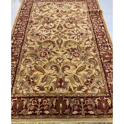 474 - Full wool pile handmade Indian tea washed Agra carpet, overall decorated with floral designs and rep... 