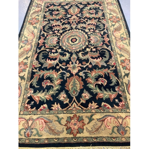 475 - Hand made full wool pile Indian tea washed Agra cream and black ground rug, overall with floral and ... 