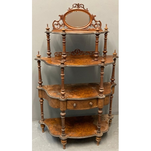 66 - Victorian walnut four tier Whatnot, the mirrored and pierced back above an arrangement of four shape... 