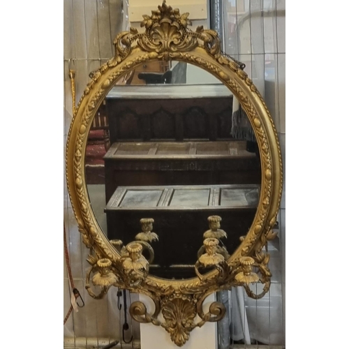 69 - 19th century gilt gesso framed oval Girandole mirror with shell and scroll work pediment above egg a... 