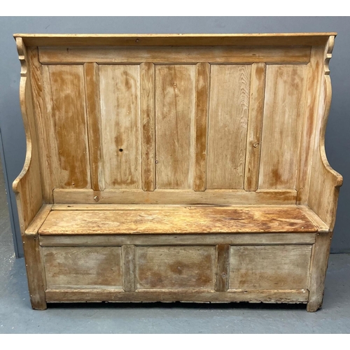 71 - 19th century pine settle, the high back with five fielded panels, shaped arms with box seat and lid,... 