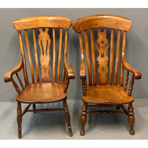 72 - Two similar elm and ash Windsor splat back armchairs, one with carved heart decoration, both with so... 