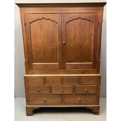 74 - Early 19th century Welsh oak Cardiganshire two stage press cupboard, the moulded cornice above two f... 