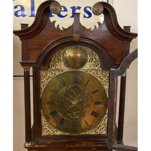 63A - Late 18th century eight day oak longcase clock having broken swan neck pediment above arched apertur... 