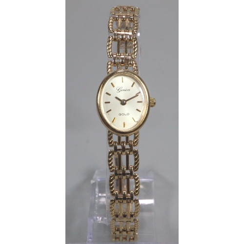 412 - 9ct gold Geneve oval ladies bracelet wristwatch with satin face, having baton numerals and bar link ... 