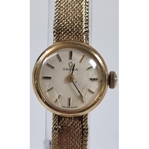 418 - Omega 9ct gold ladies bracelet wristwatch, having satin face with baton numerals and fine mesh brace... 