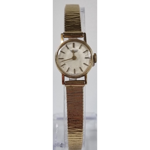 419 - Longines 9ct gold ladies wristwatch with satin face, having baton numerals and 9ct gold bark finish ... 