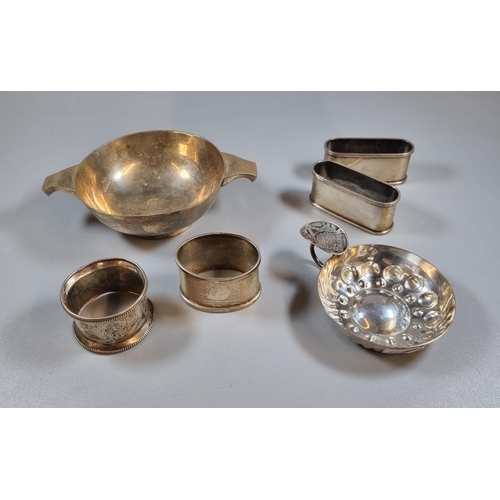 202 - Collection of silver items to include: four napkin rings together with a silver Quaich, Sheffield ha... 