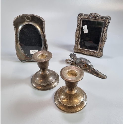 212 - Pair of silver dwarf candlesticks with loaded bases together with two miniature silver easel picture... 