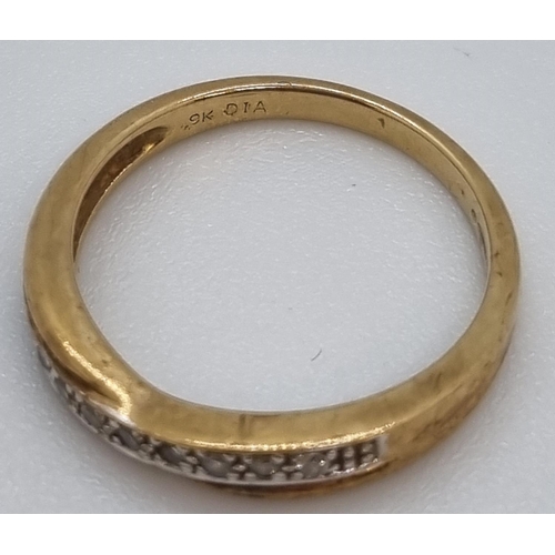 217 - 9ct gold nine stone eternity style ring.  2.1g approx.  Size L.   (B.P. 21% + VAT)