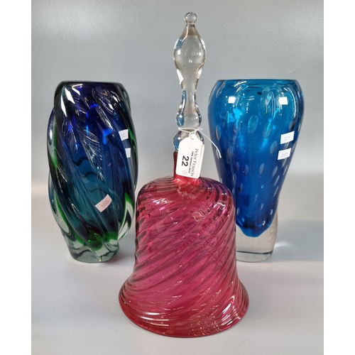 22 - Cranberry glass writhen design hand bell, together with two Murano style blue ground Art glass vases... 