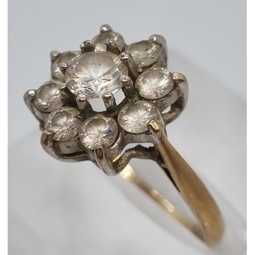 222 - 9ct gold clear stone flowerhead dress ring.  2.9g approx.  Size M1/2.   (B.P. 21% + VAT)