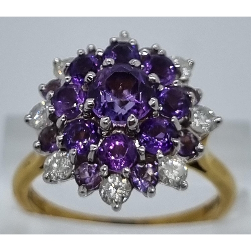 240 - 18ct gold diamond and probably tanzanite multi cluster ring comprising a total of eight diamonds.  6... 